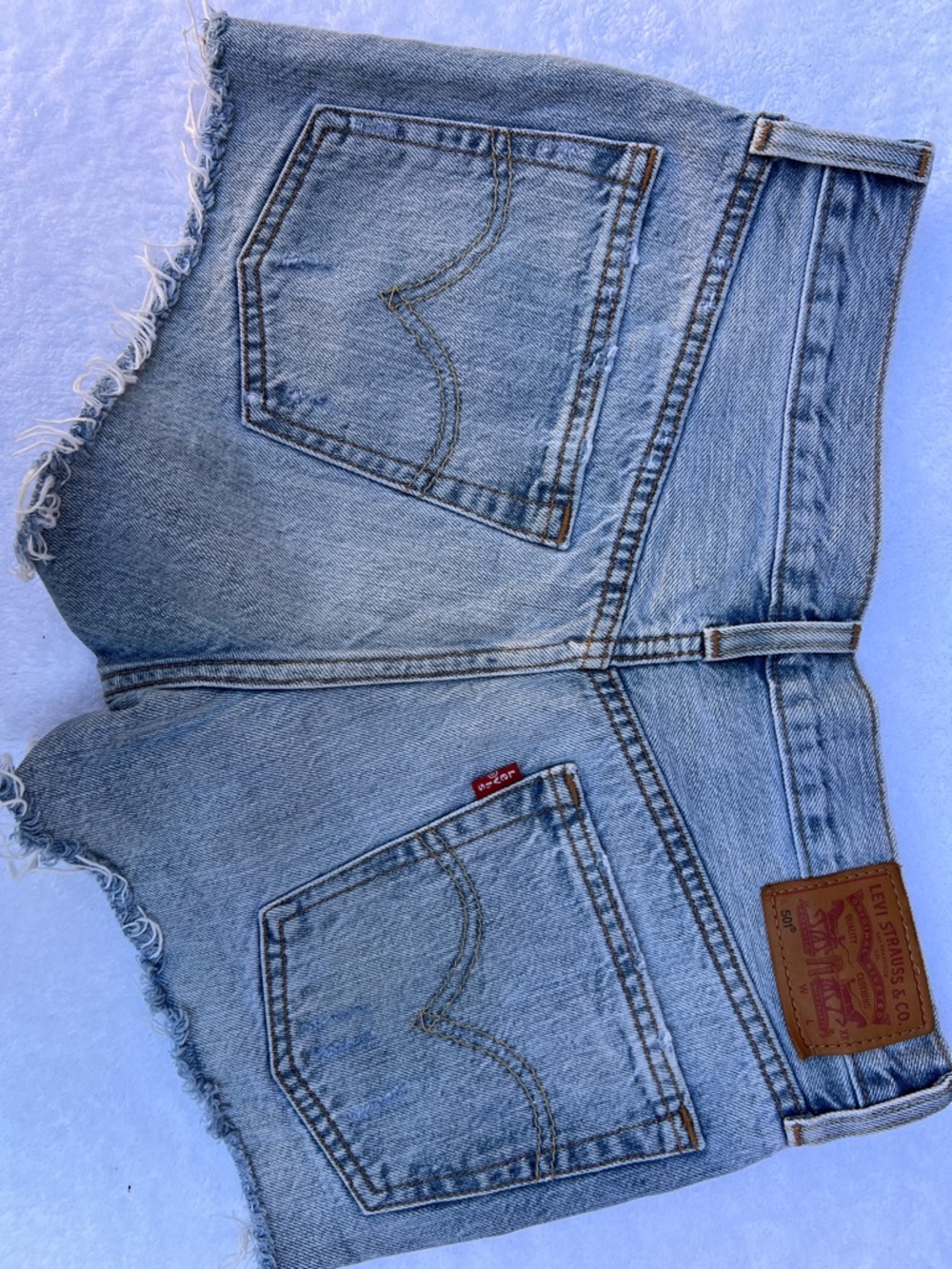 Levi's Light Blue Frayed Denim Cutoff Shorts